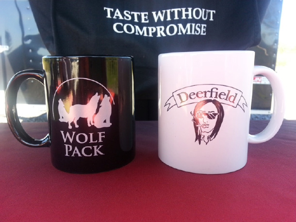 Deerfield and Wolfpack coffee mugs